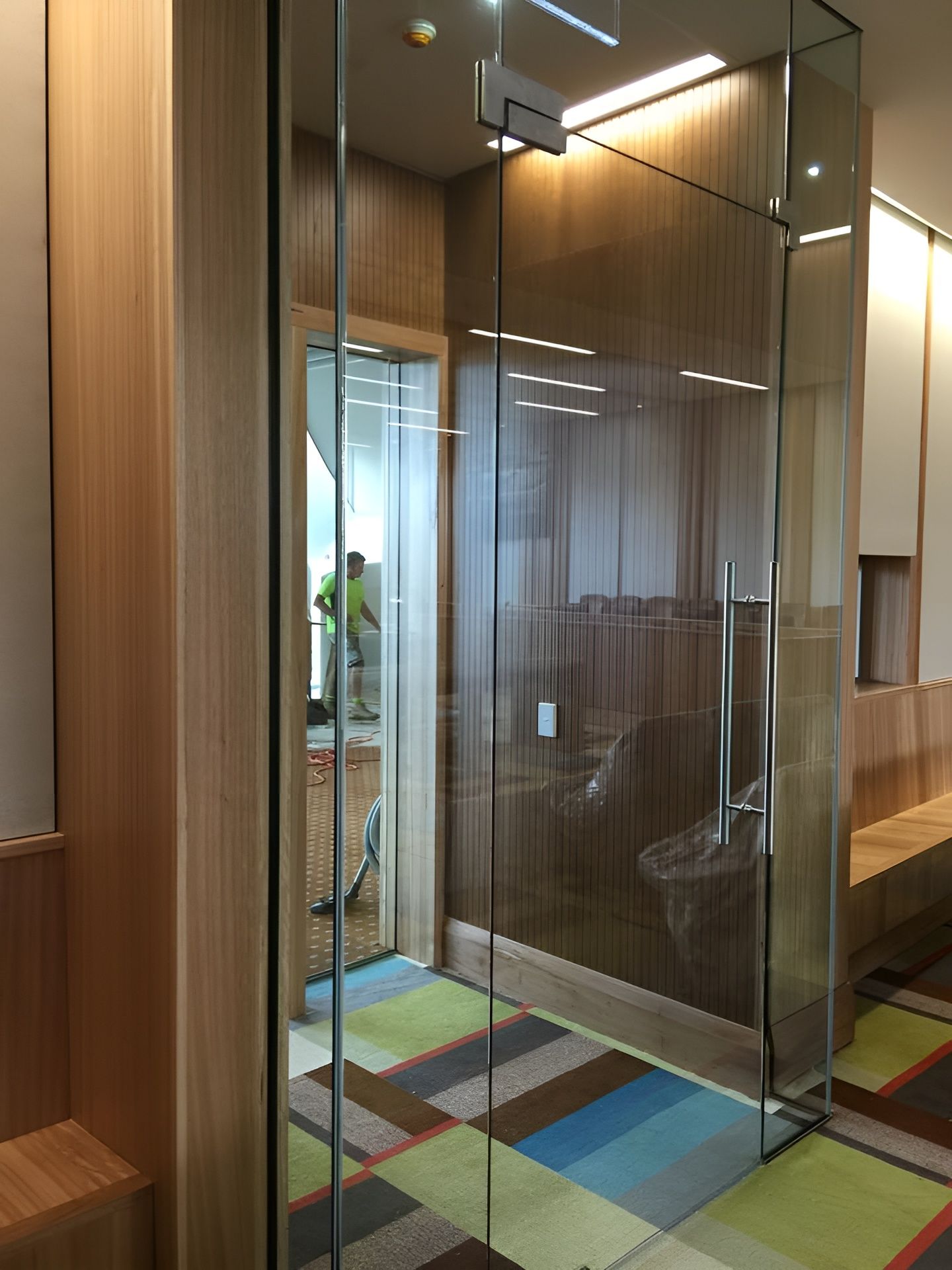 Glass-Walled Room with Wooden Accents — Master Glass & Glazing in Toronto, NSW