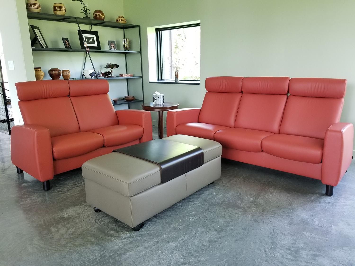Red modern leather couch and loveseat sold at Eagles' Rest Natural Mattresses and Furniture inLawrence, Kansas.