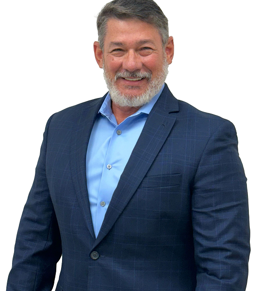 Man in blue blazer and shirt smiling, studio shot.
