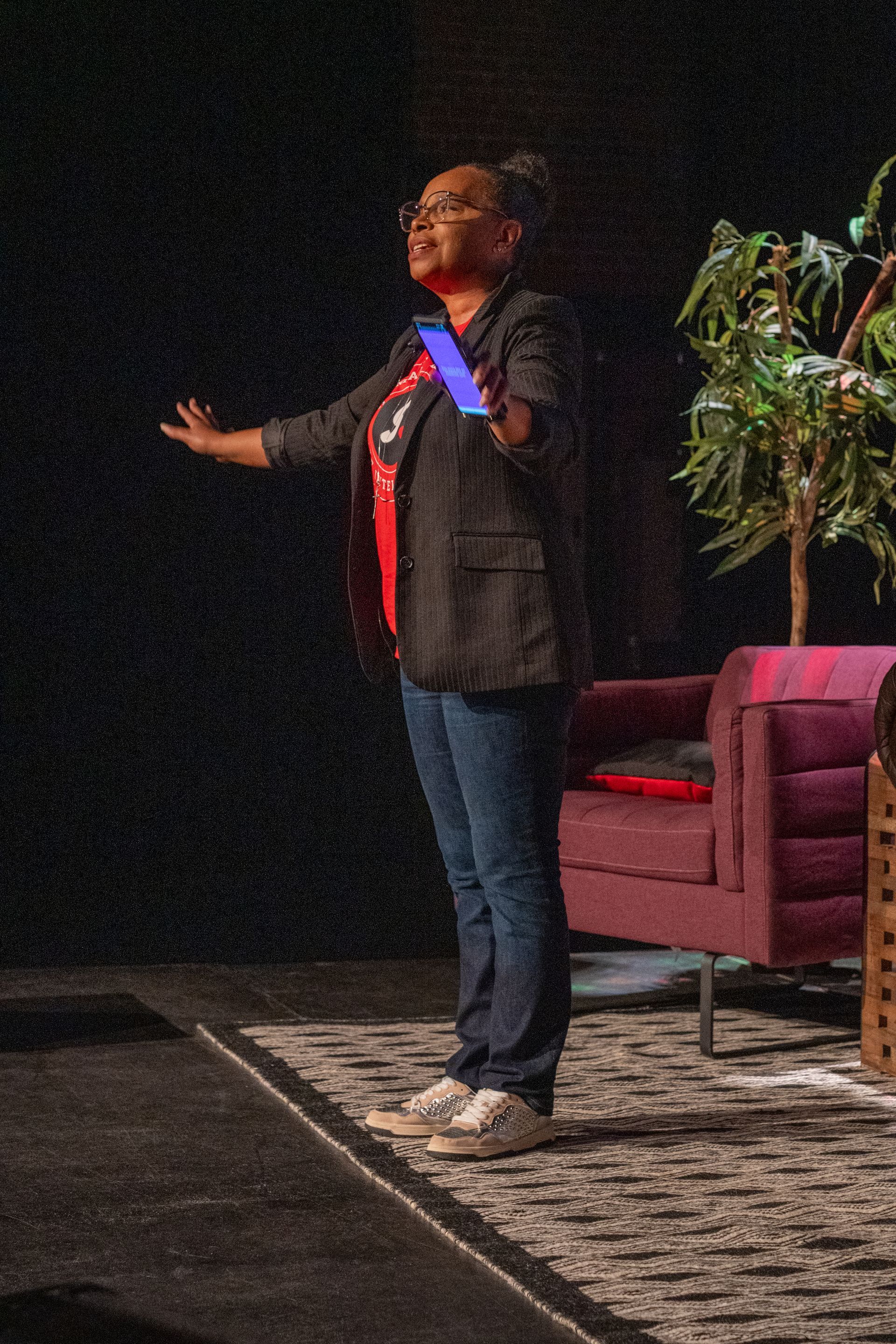 Lia Nichole Smith speaks on stage at Podcast Palooza