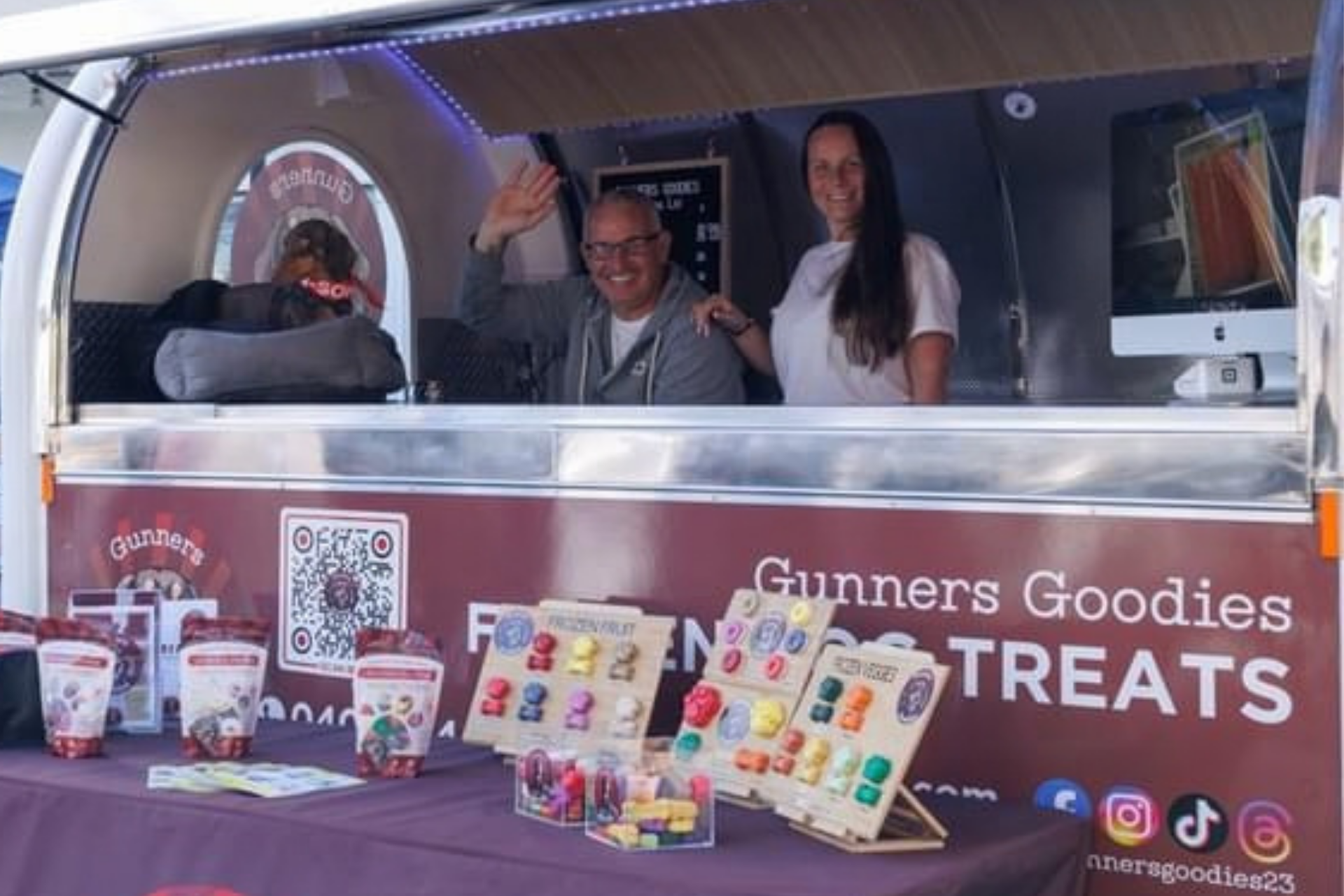 Gunners Goodies market stall with frozen dog treats on display.