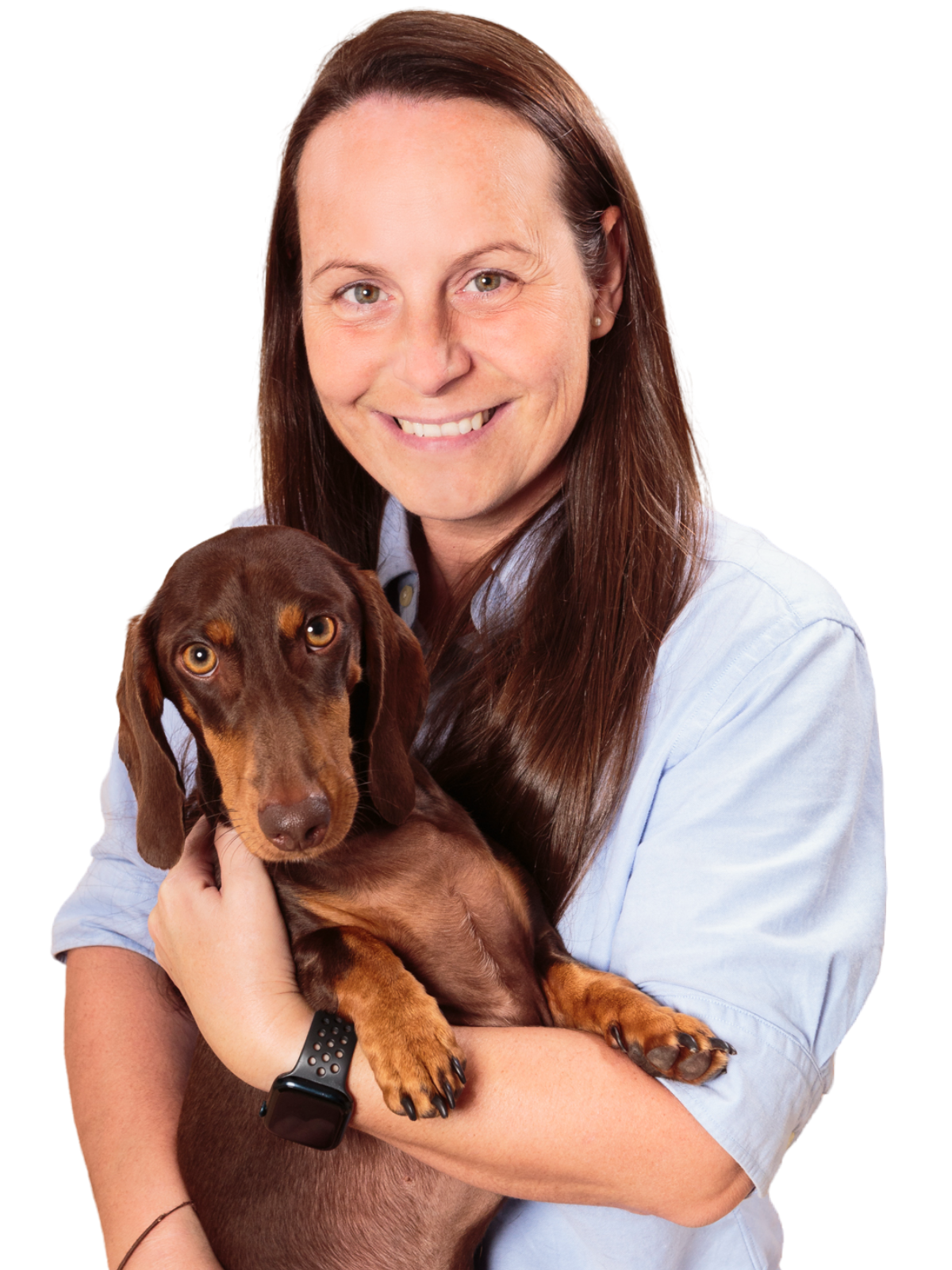 Kelly holding Gunner, the miniature dachshund behind Gunners Goodies