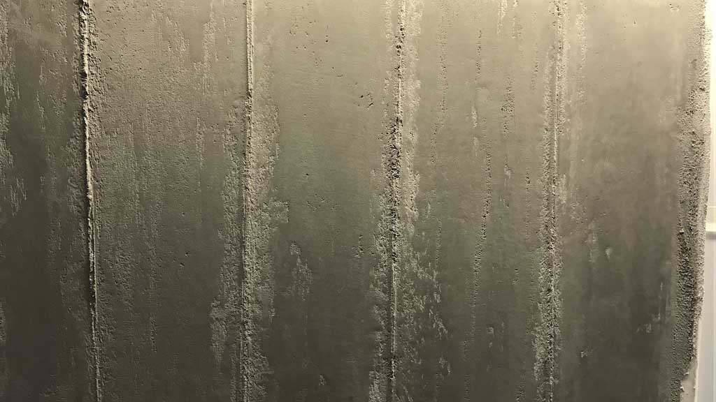 detail of venezia stucco dark beton plaster sample