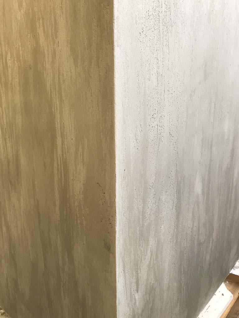 detail of a cabinet with grey beton stucco plaster walls