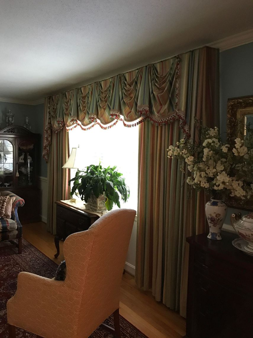 Sunlit Low Country living room with sheer linen draperies