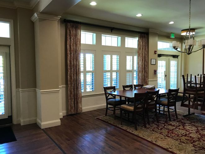Floor to ceiling custom drapery panels in a formal dining room