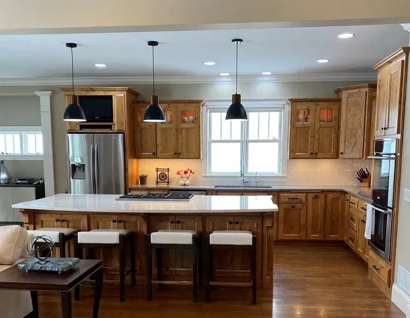 A kitchen with wooden cabinets and stainless steel appliances