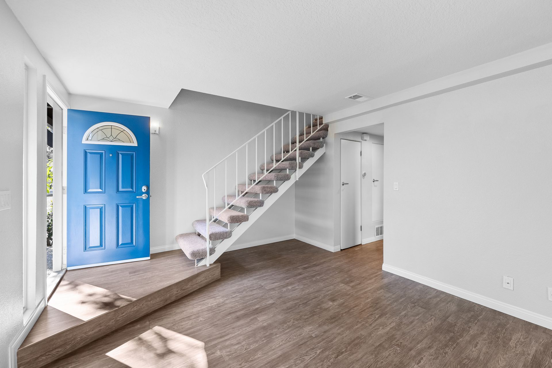 Interior Photo of Property - living room and stairs