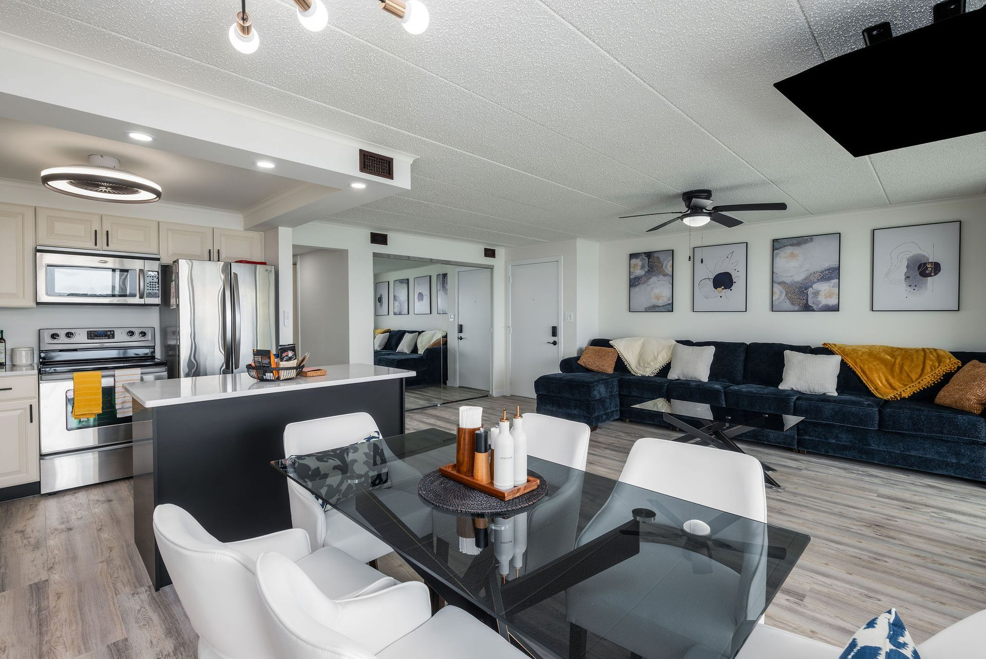 Open-concept living space with kitchen, dining area, and living room.
