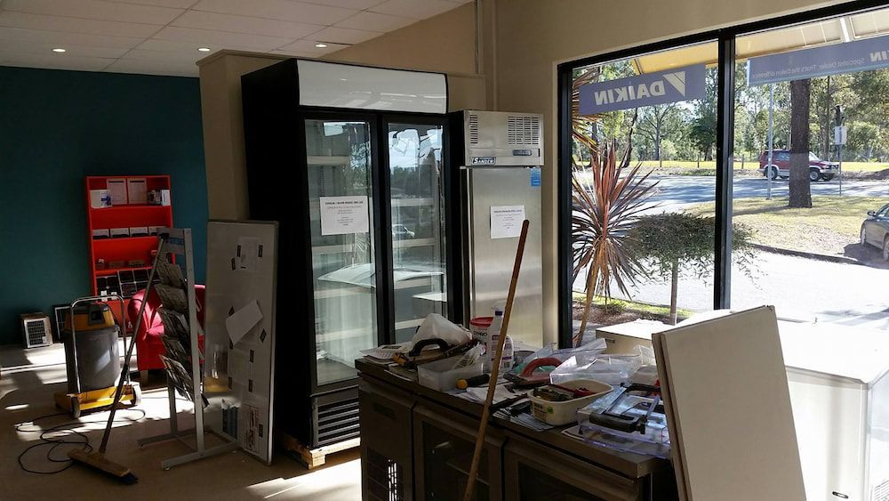 A Room With Two Refrigerators And A Table In It — Mackies In Taree, NSW