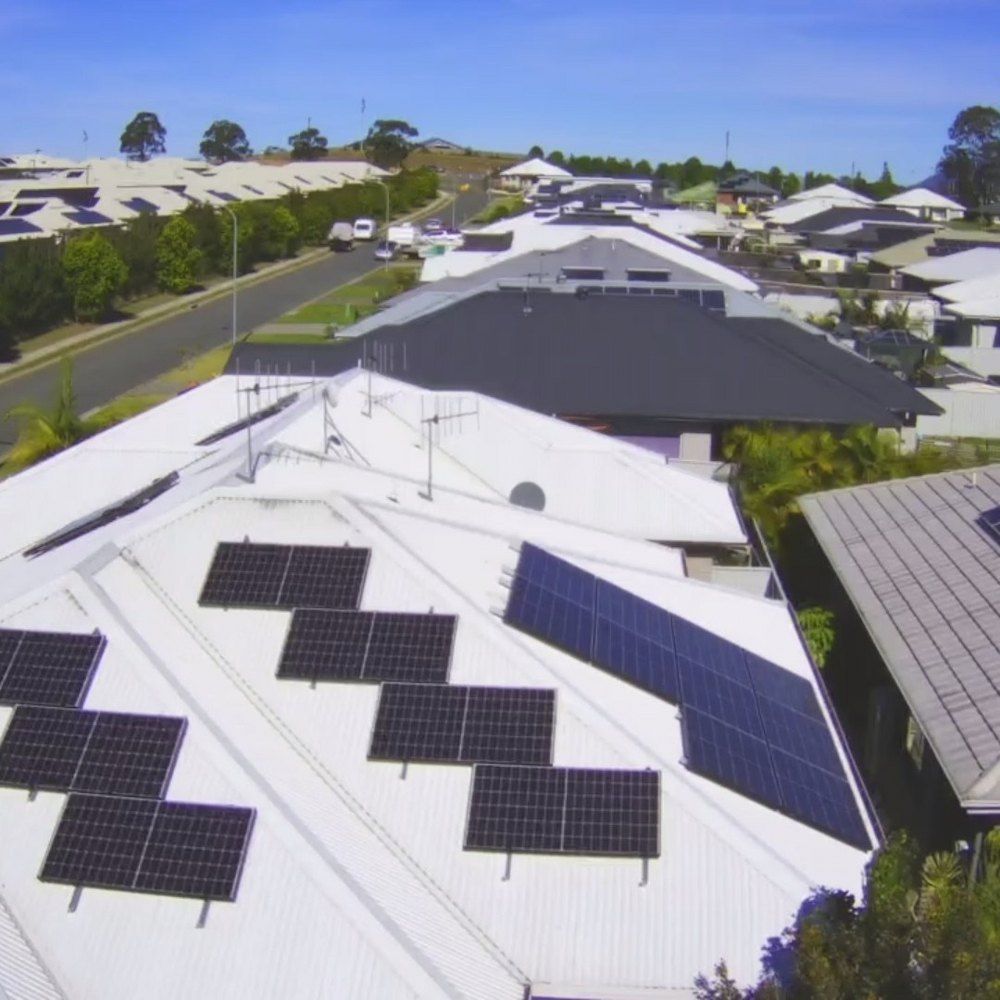 A Row Of Solar Panels On The Roof Of A House — Mackies In Taree, NSW