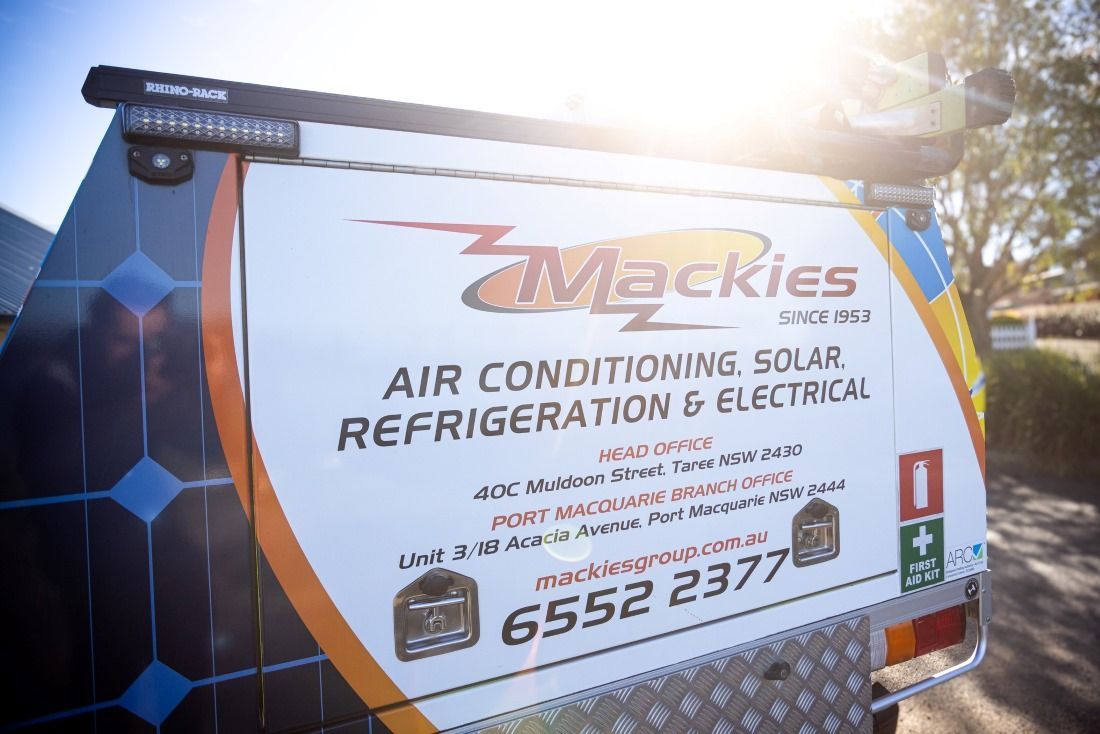 Back Of A White Service Vehicle With The Mackie's Logo — Mackies In Coffs Harbour, NSW