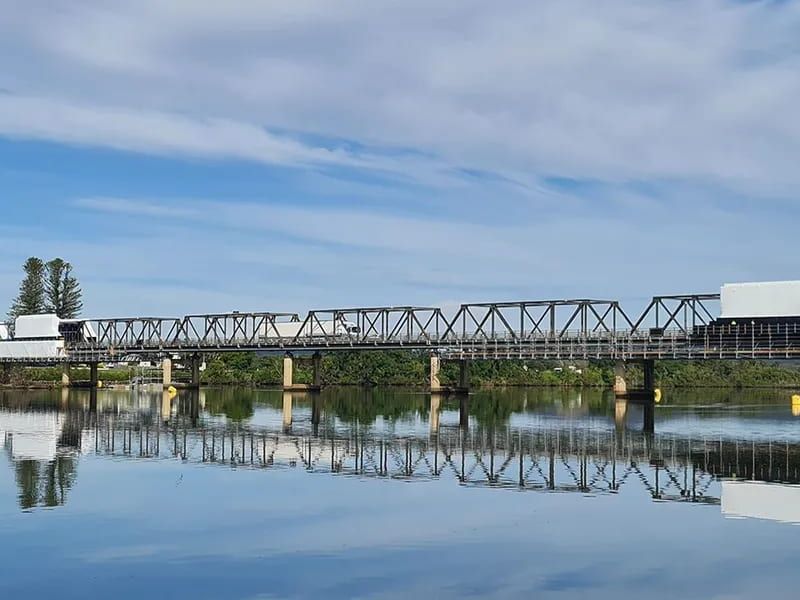 A Bridge Over A Body Of Water With A Train On It — Mackies In Taree, NSW