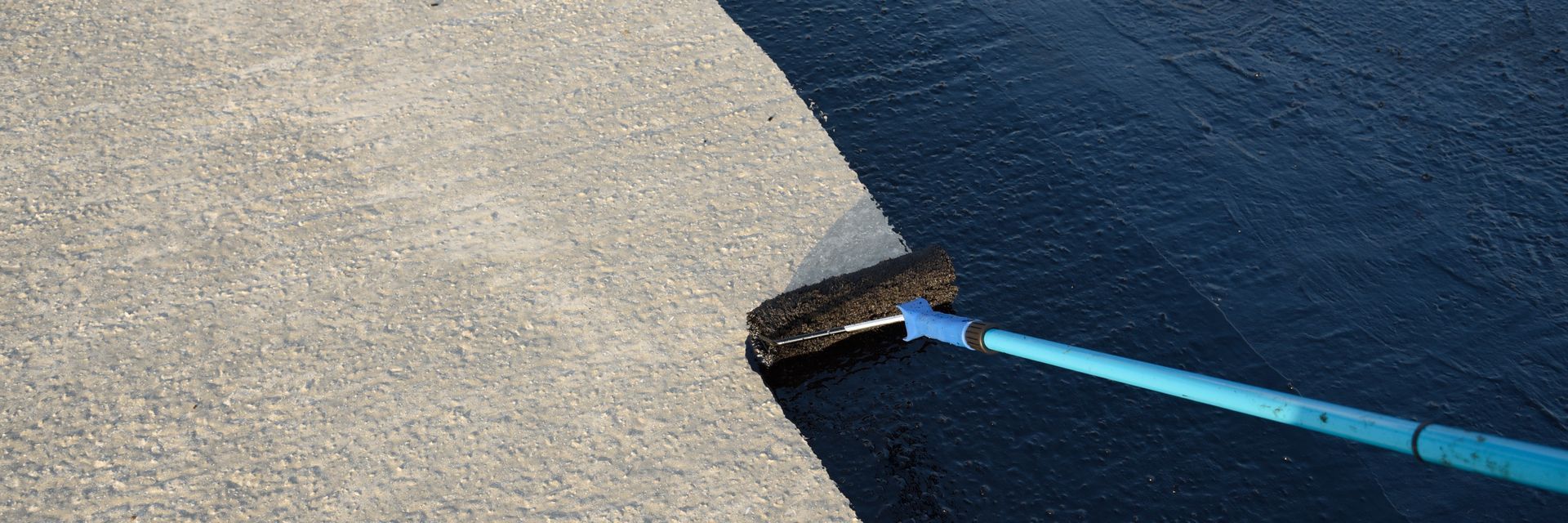 Dock edge with a blue mooring line attached to a cleat beside dark water. Dock edge with a blue mooring line attached to a cleat beside dark water.