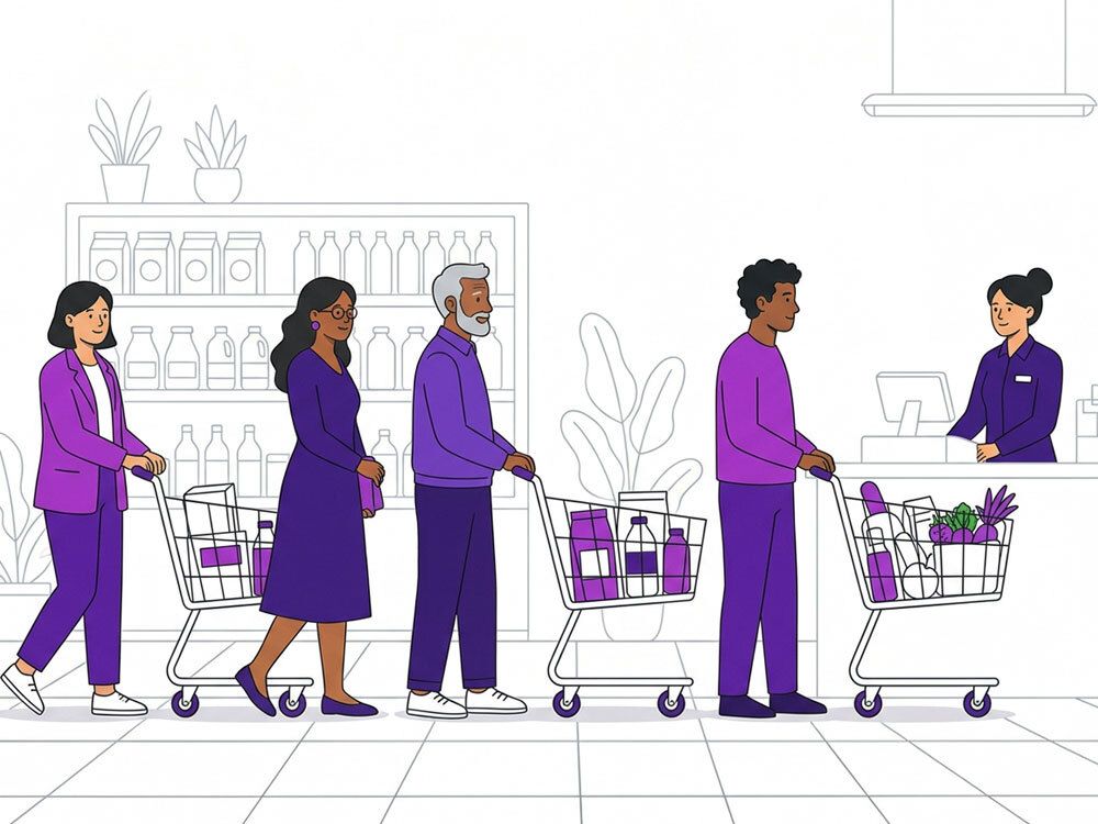 People with shopping carts and a cashier in a grocery store checkout line