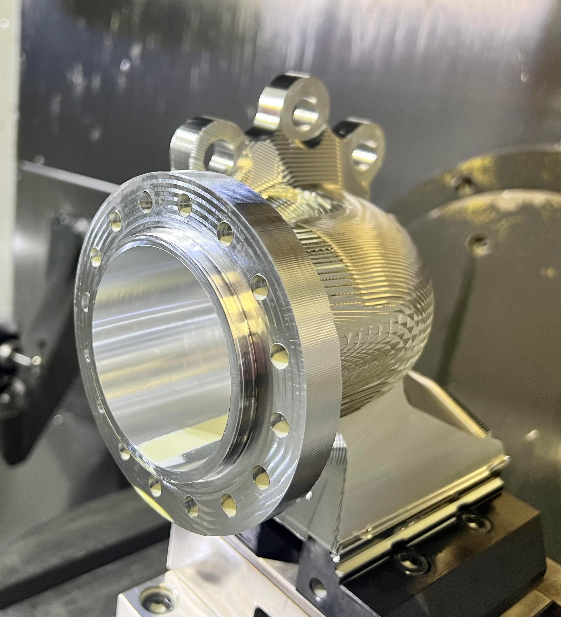A close up of a metal object on a machine