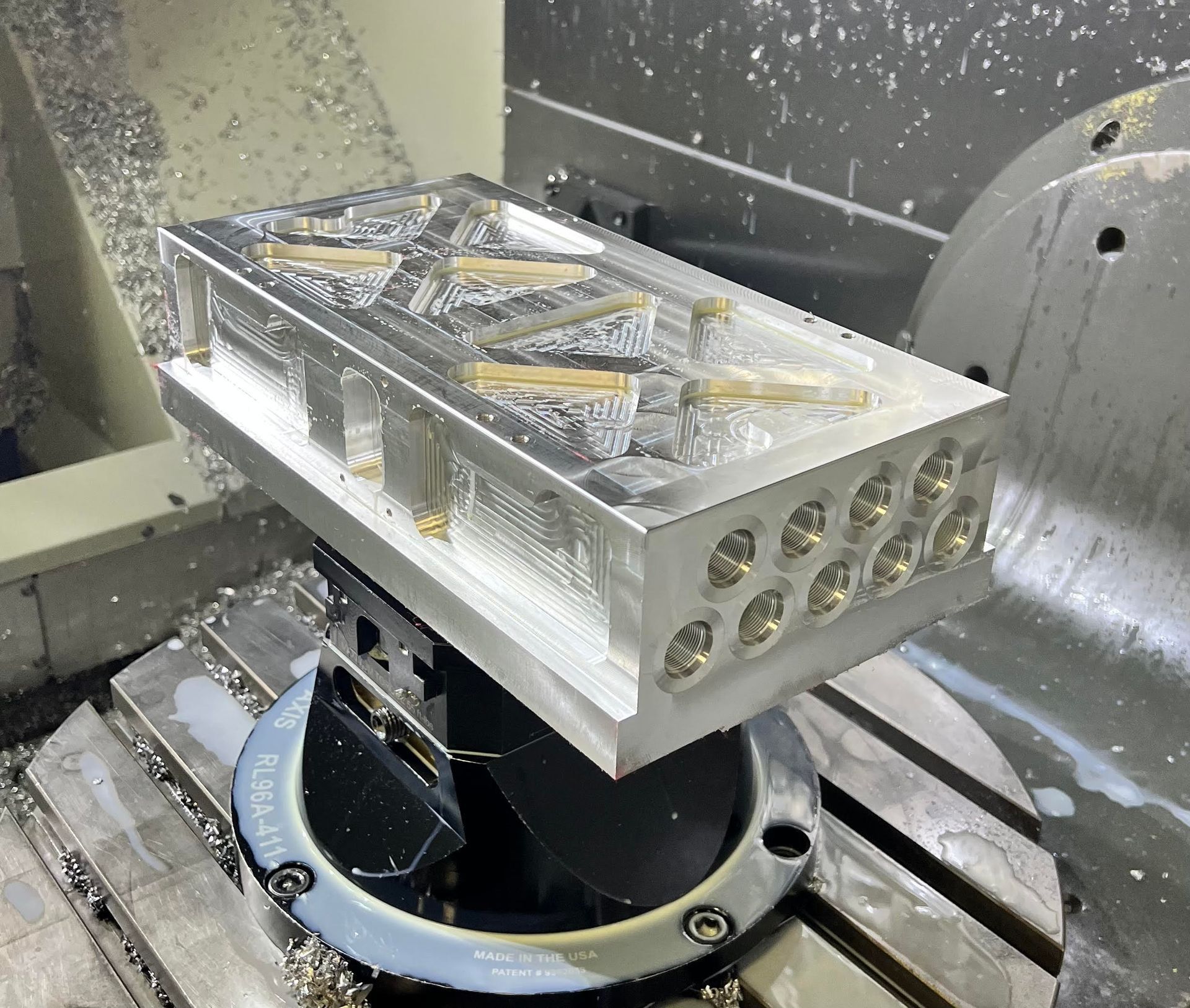 A piece of metal is sitting on top of a machine.