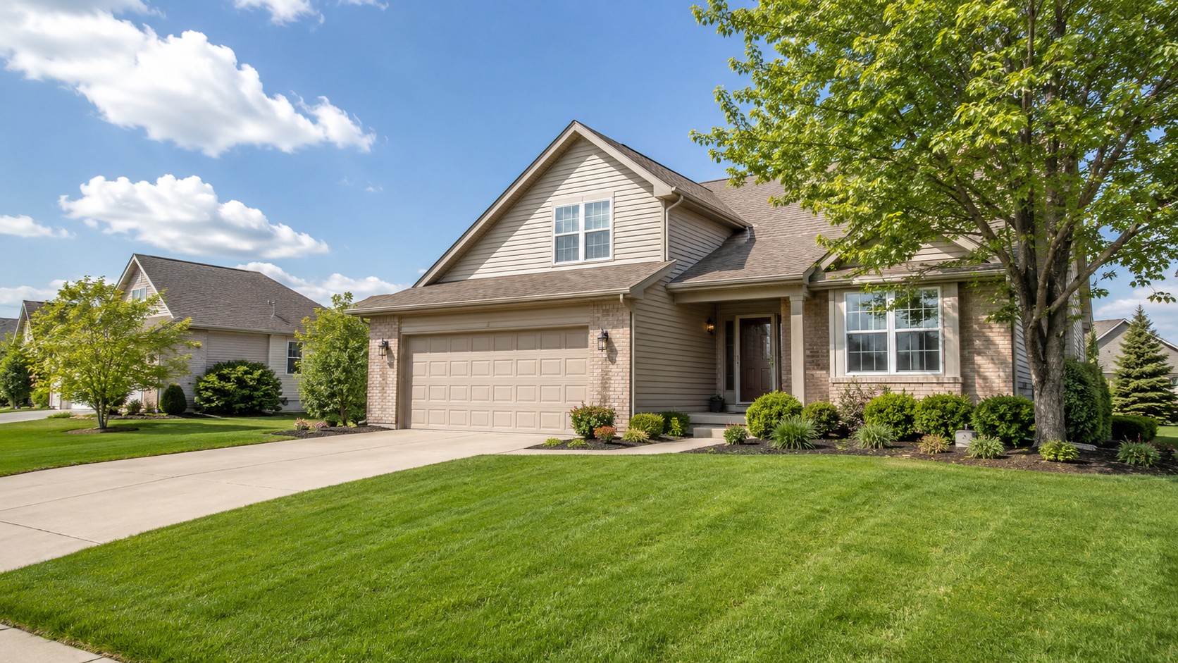 Well-maintained family home for sale in Crown Point, Indiana with lawn, driveway, garage, and trees