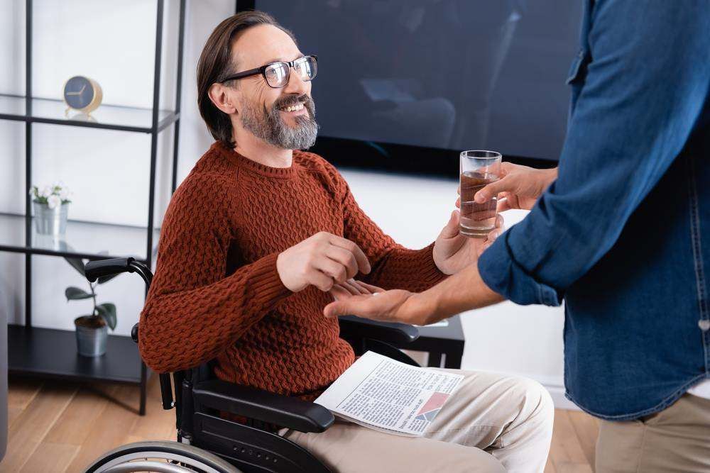 A Nurse Is Listening to An Elderly Woman's Heartbeat with A Stethoscope — Coast 2 Coast Disability Support Services in Taree, NSW