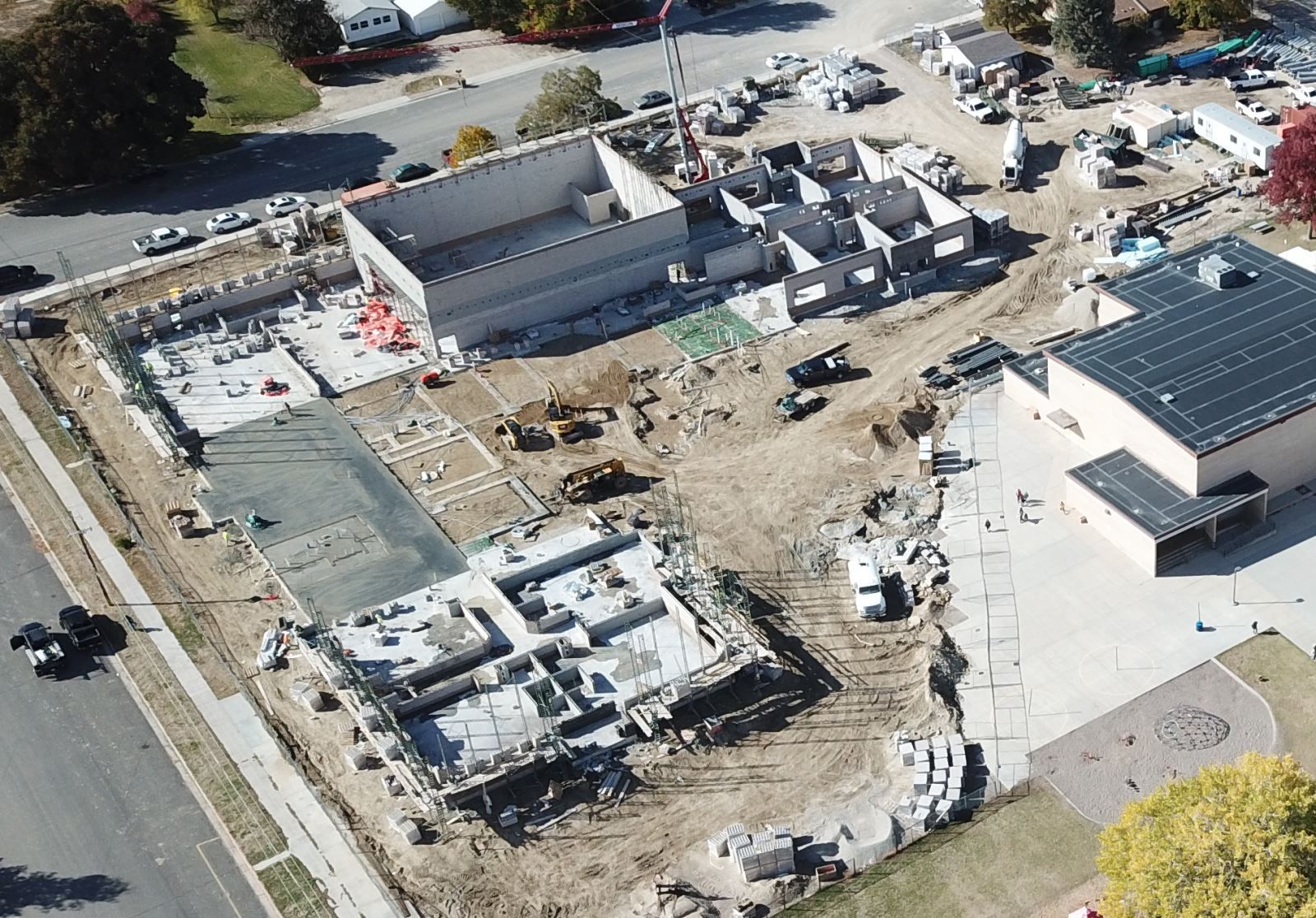 An aerial view of a construction site with a building under construction.