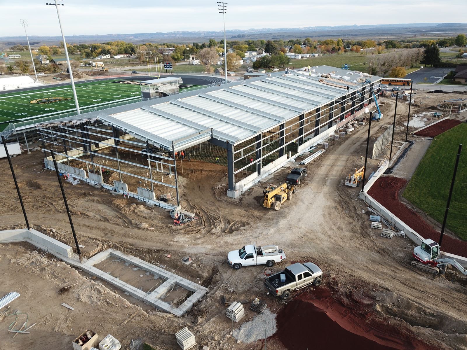 An aerial view of a large building under construction.
