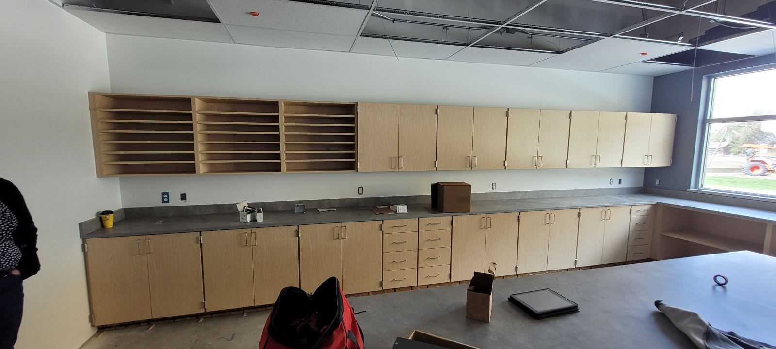 A kitchen with a lot of cabinets and a table.