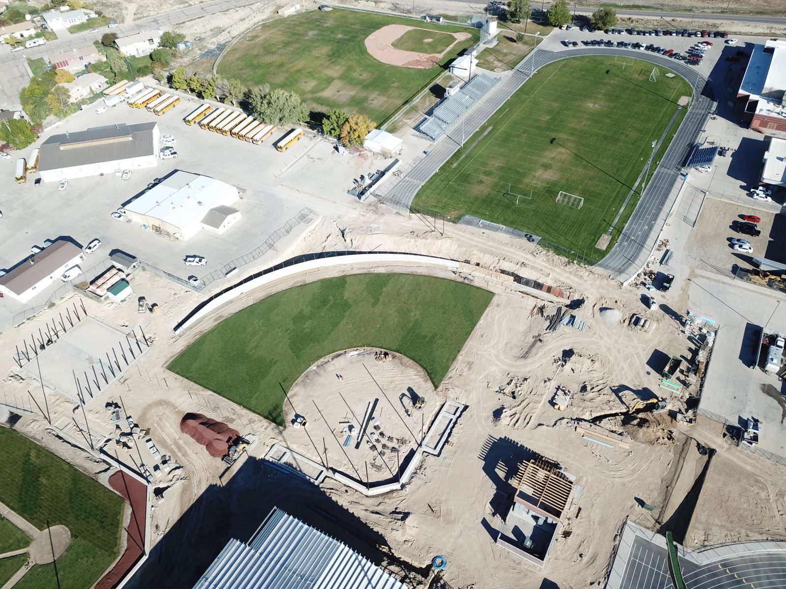 An aerial view of a baseball field and a track