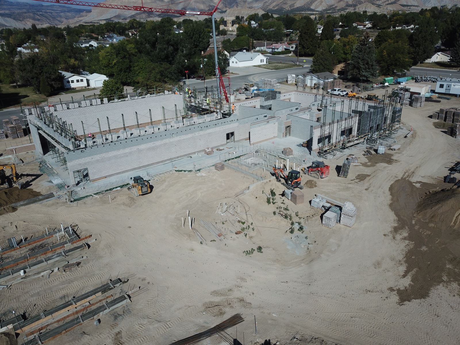 An aerial view of a large building under construction.