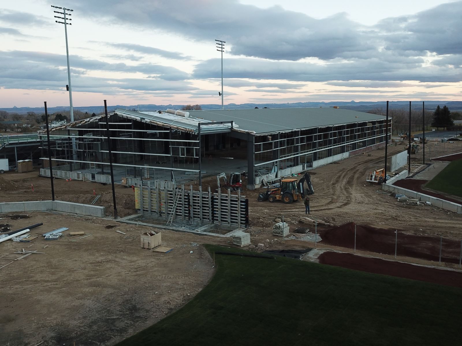 An aerial view of a large building under construction.