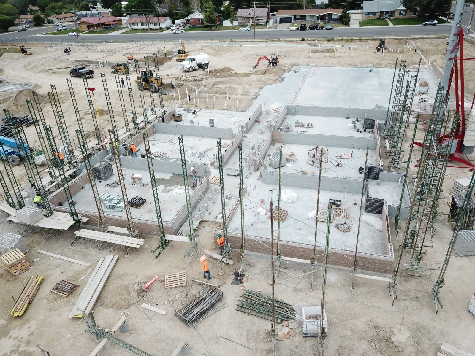 An aerial view of a construction site with a large building under construction.
