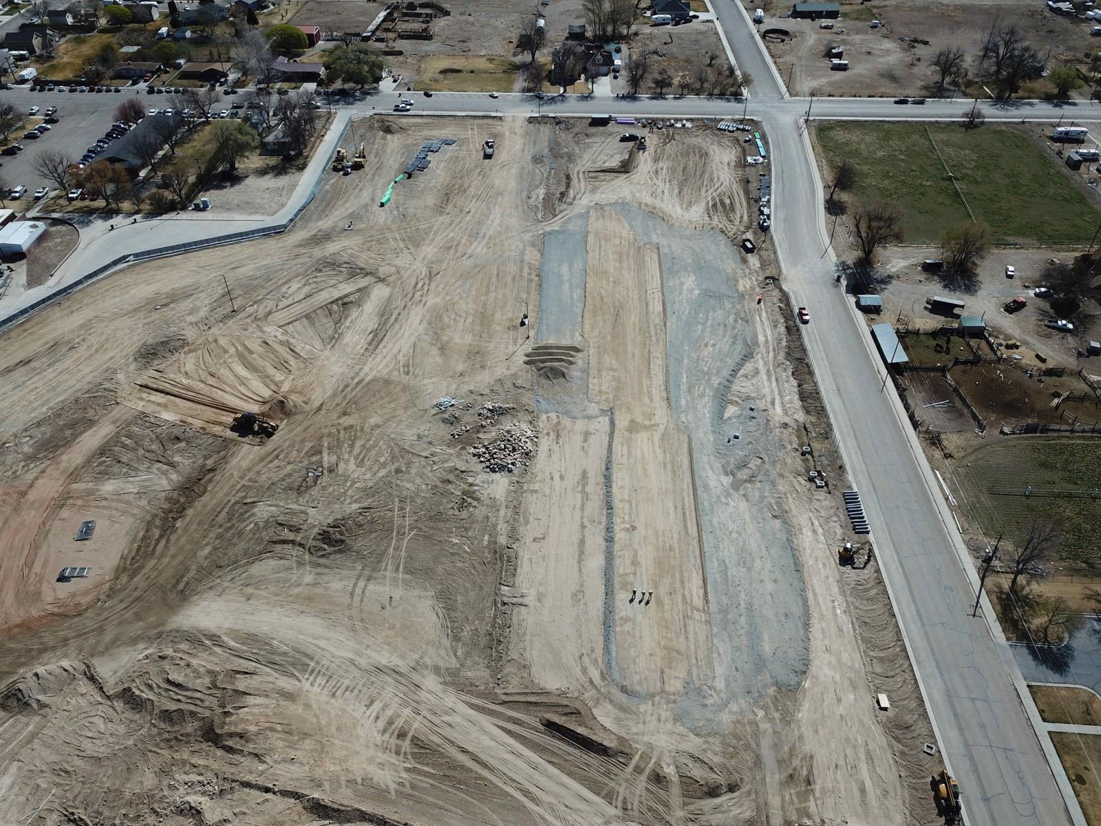 An aerial view of a construction site with a lot of dirt.