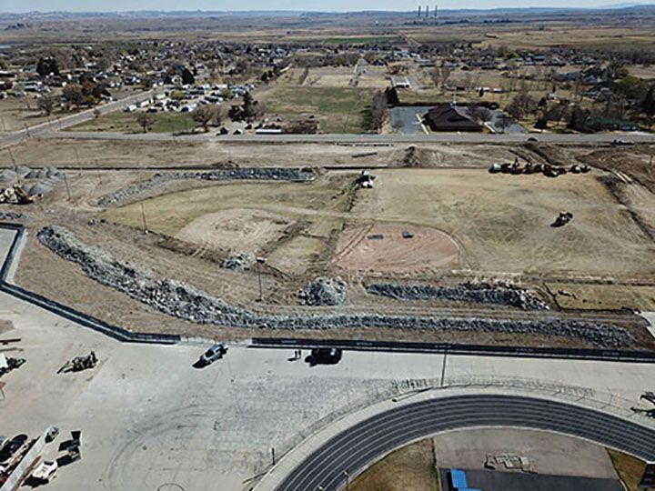An aerial view of a baseball field and a track.