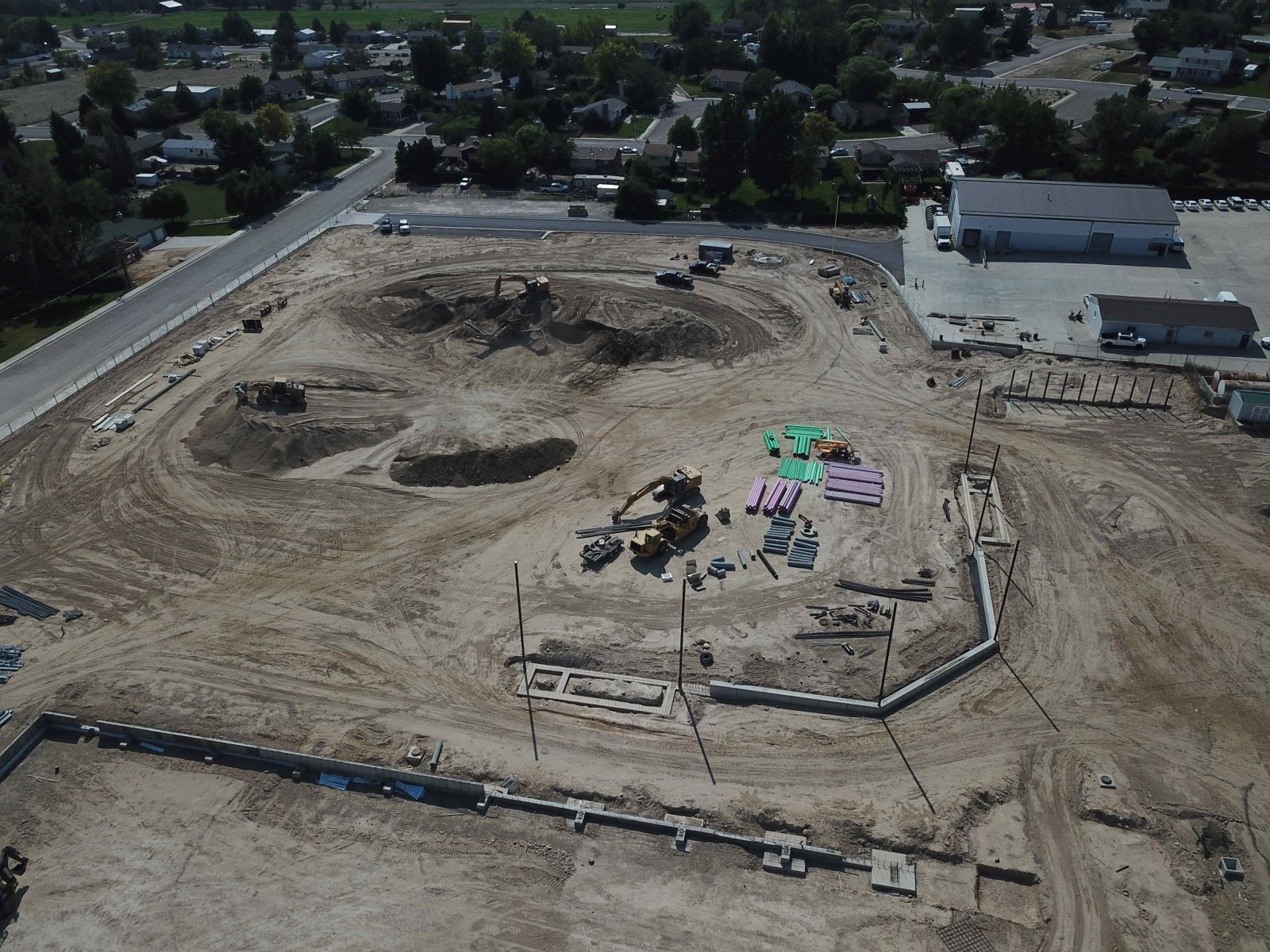 An aerial view of a construction site with a lot of dirt