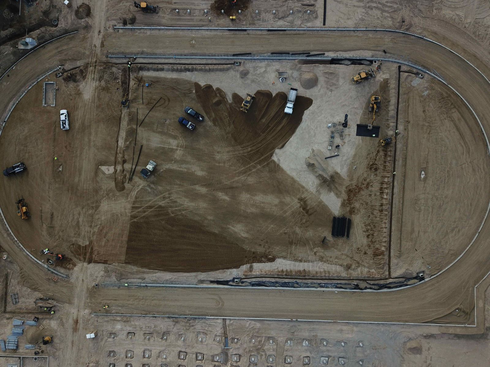 An aerial view of a dirt track under construction