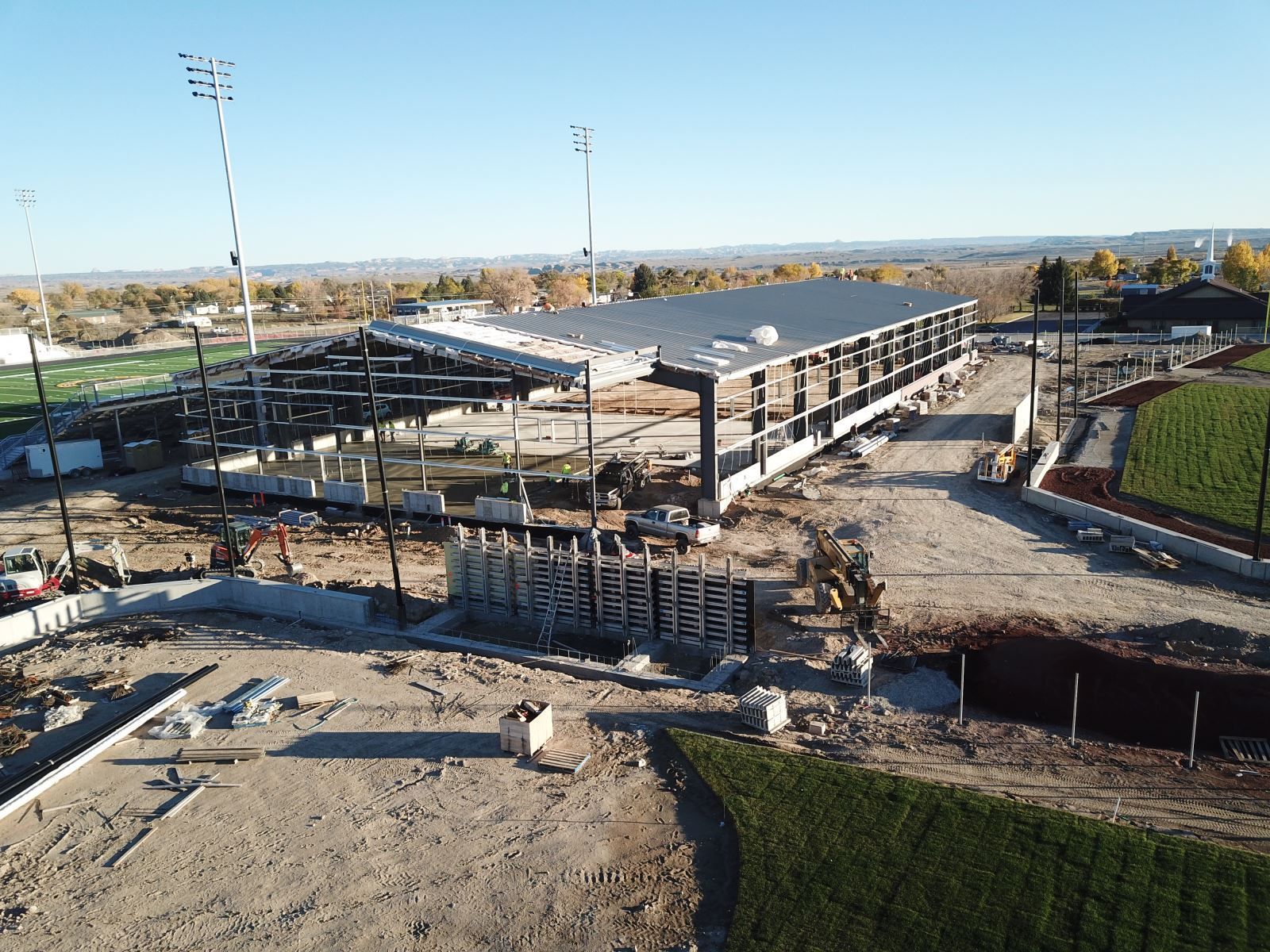 An aerial view of a large building under construction.