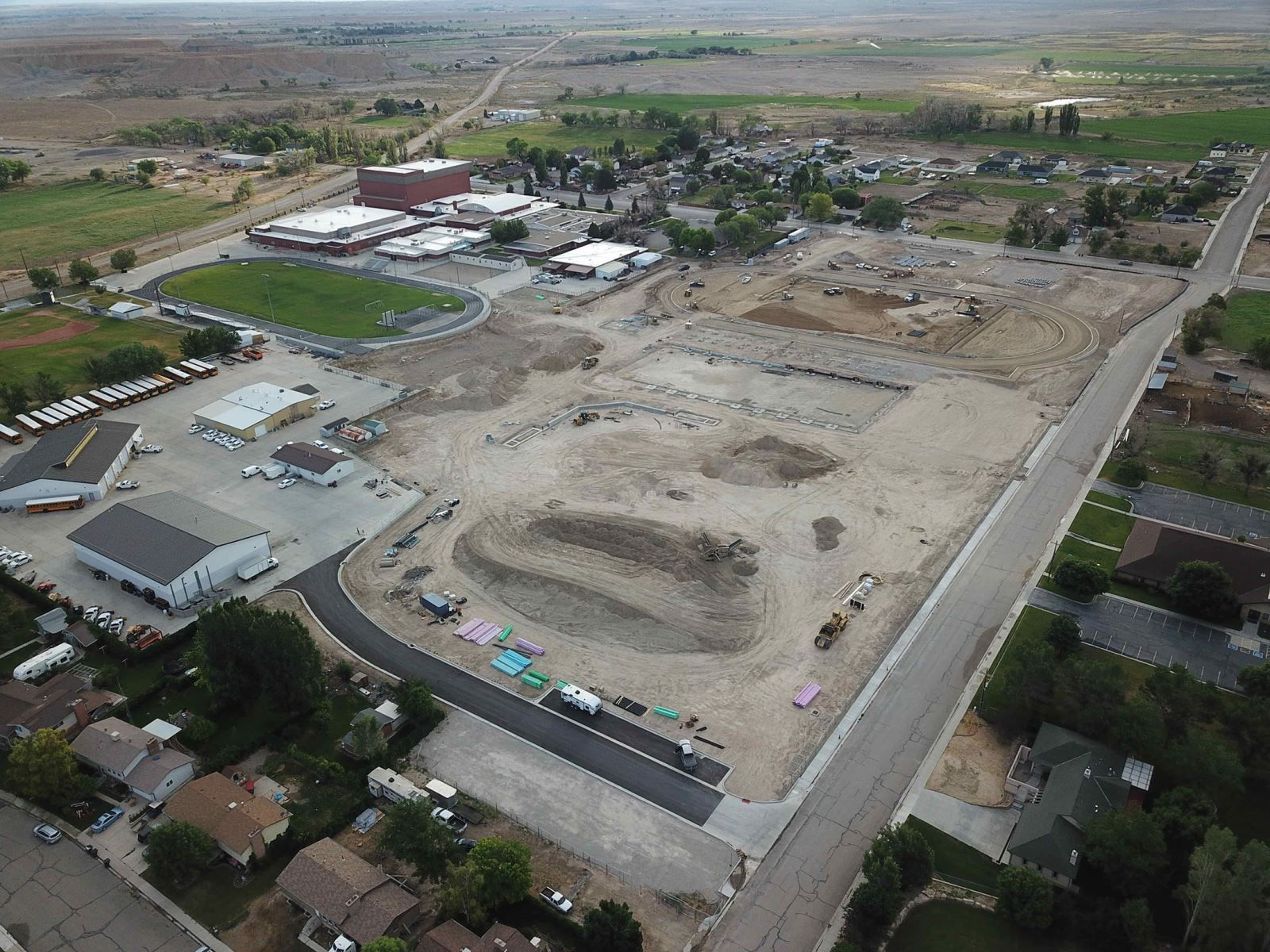 An aerial view of a construction site in a small town.