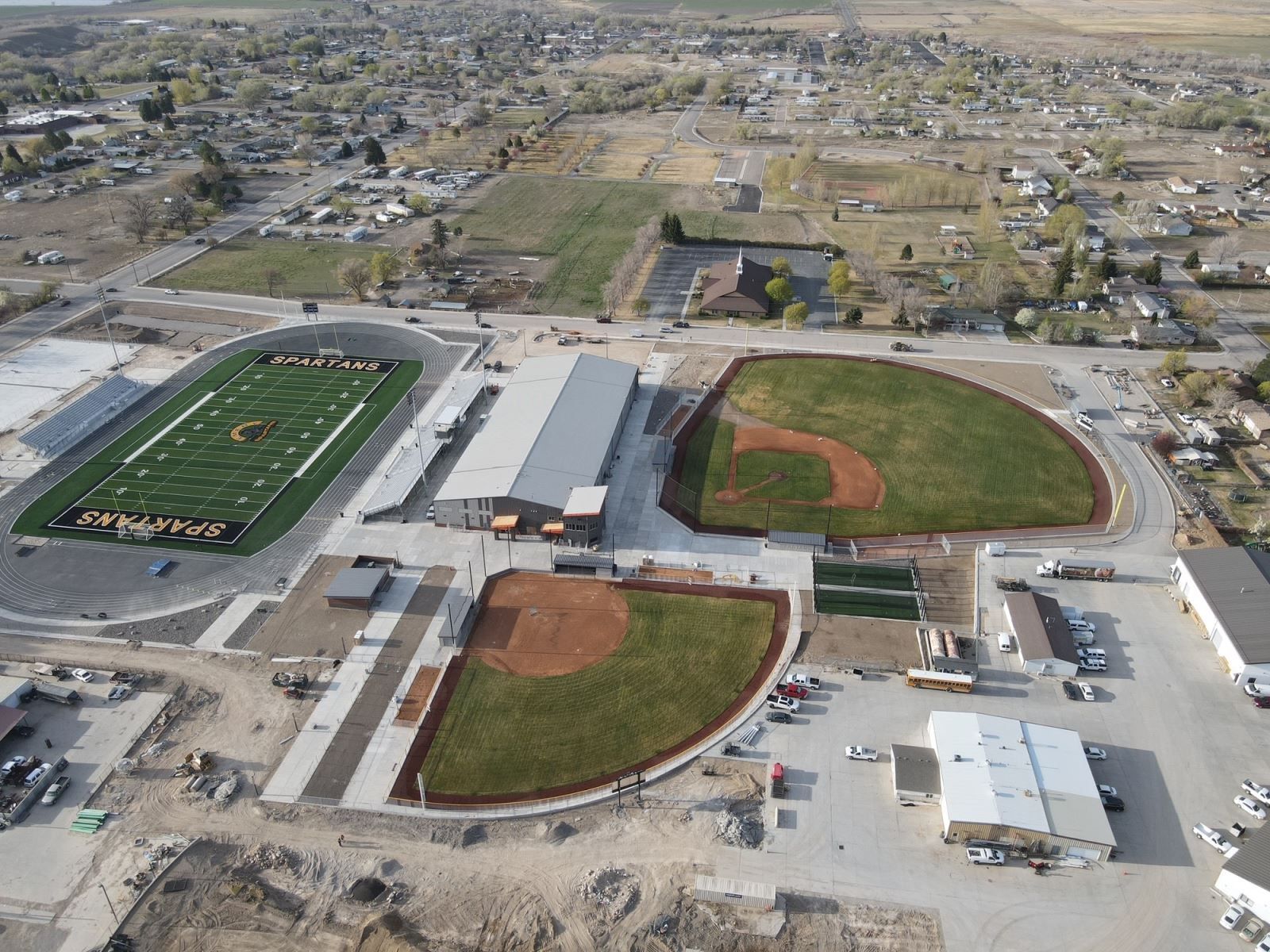 An aerial view of a baseball field and a football field