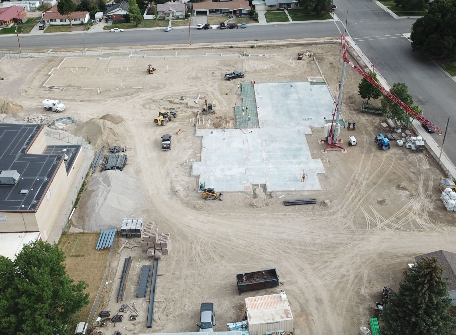 An aerial view of a construction site with a building under construction
