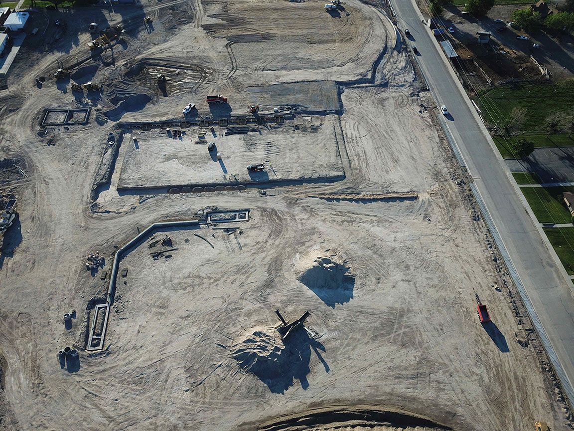 An aerial view of a construction site with a lot of dirt.
