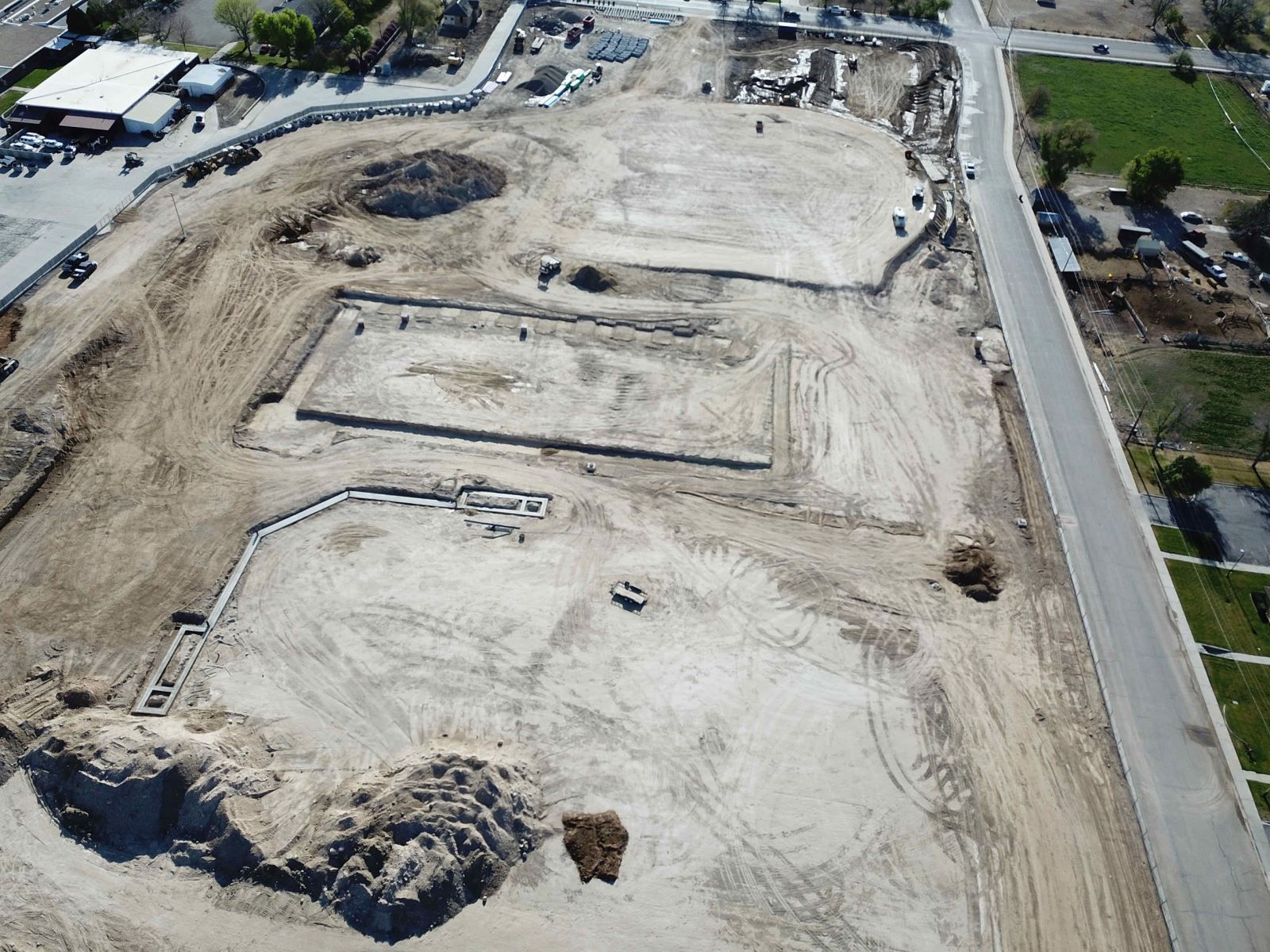 An aerial view of a construction site with a lot of dirt.