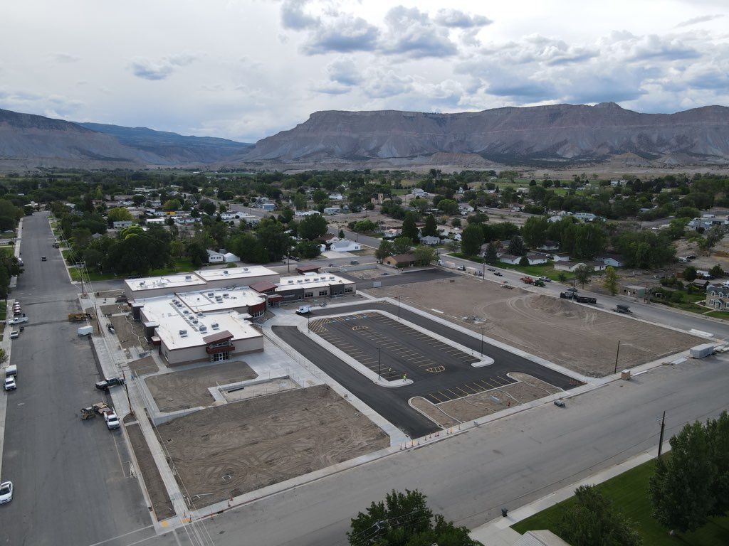An aerial view of a city with mountains in the background.
