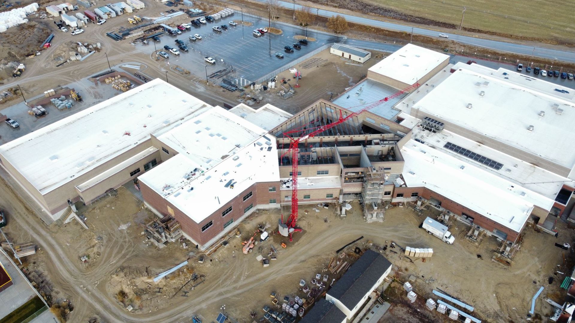 An aerial view of a large building under construction.
