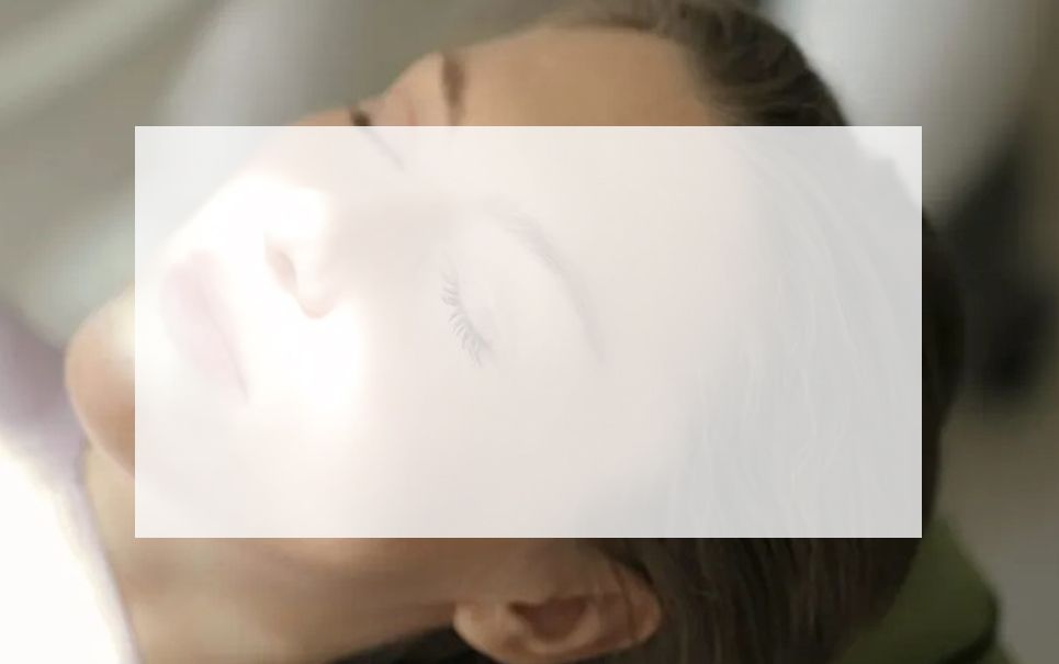 A close up of a woman 's face with a white frame around it