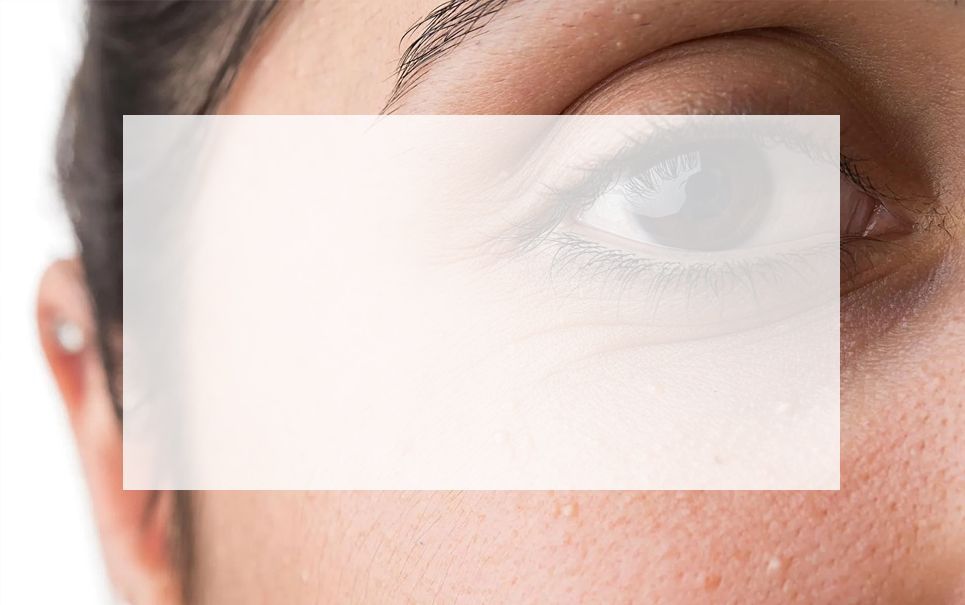 A close up of a woman 's eye with a white frame around it.