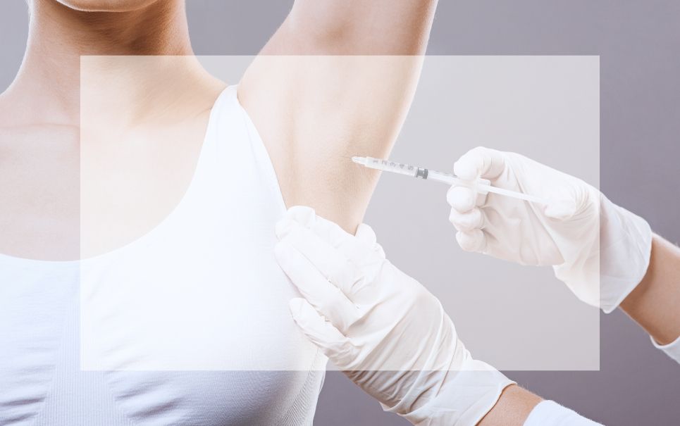 A woman is getting an injection in her armpit.