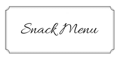 Snack menu sign in cursive text on a light background with a decorative border