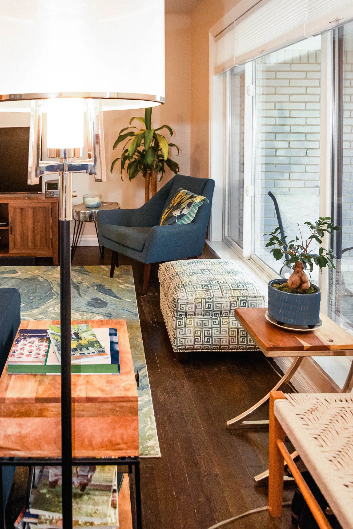 A living room with a lot of furniture and a large window.