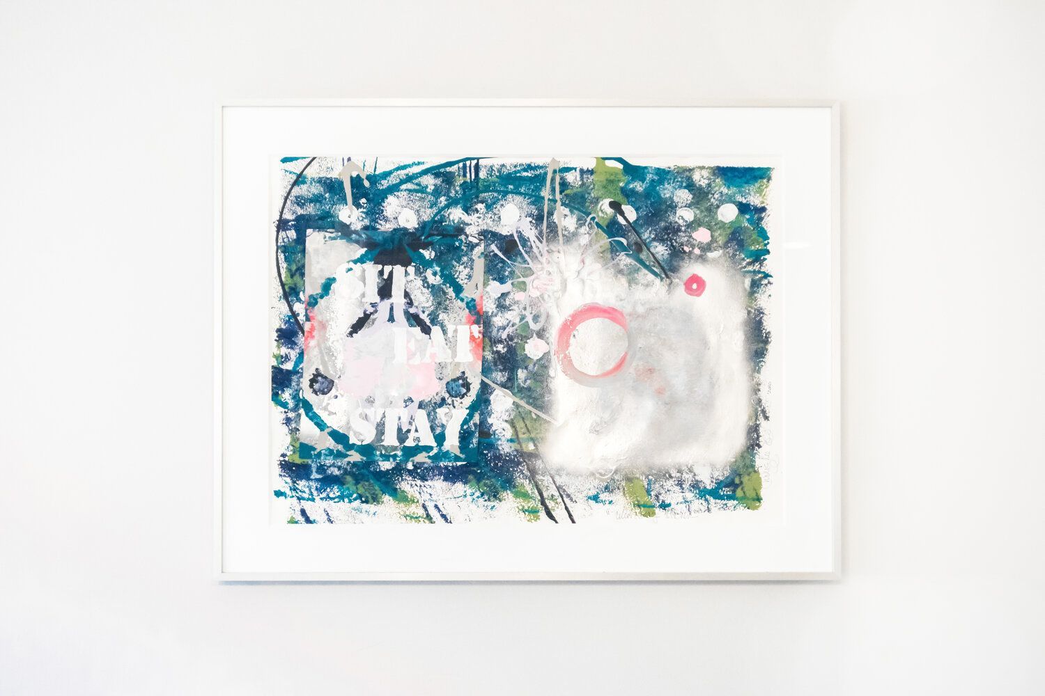 A painting is hanging on a white wall.