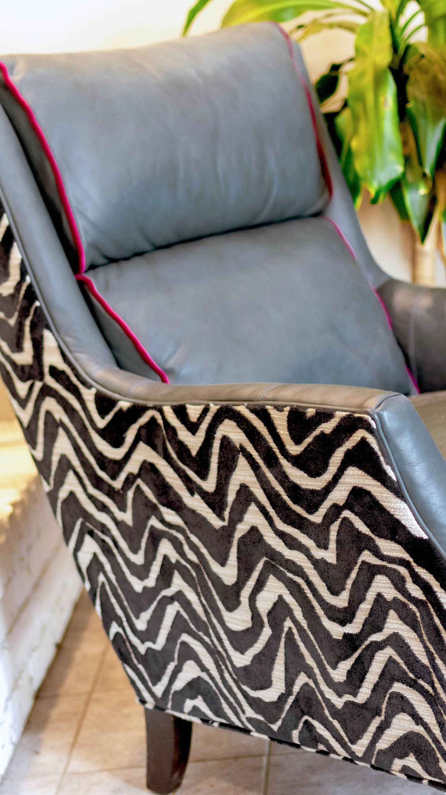 A black and white chair with a zebra print on it