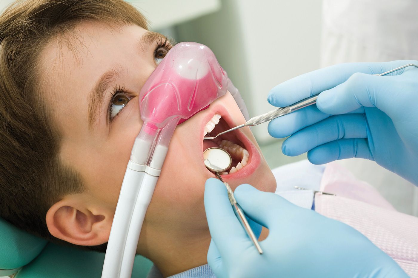 Happy gas sedation at dentist to help anxious patient feel relaxed and comfortable during treatment.